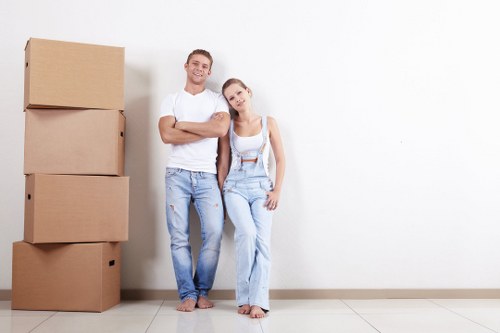 Furniture pick-up service removing a sofa in Westend