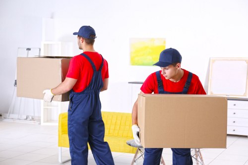 Removal team loading boxes and furniture for a Westend house move