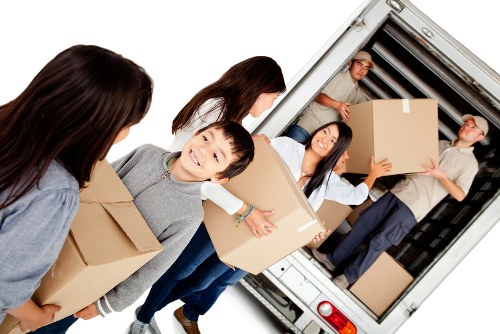 Professional movers beginning a careful relocation process with organized packing