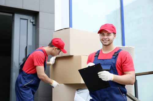 Office relocation scene with movers handling desks and equipment