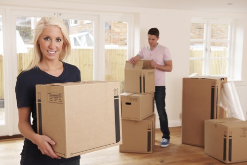 Professional movers handling flat removals in Westend at an apartment building
