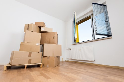 Staff using safe manual handling practices during a removal job