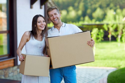 Professional movers handling office furniture in Westend