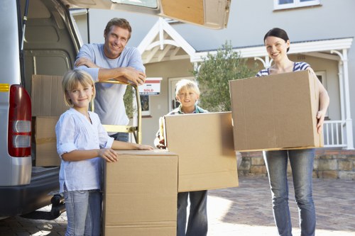 Moving team handling boxed household items during a well-planned Westend Removals service