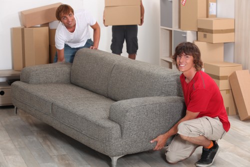 Business movers transporting office furniture during a Westend relocation